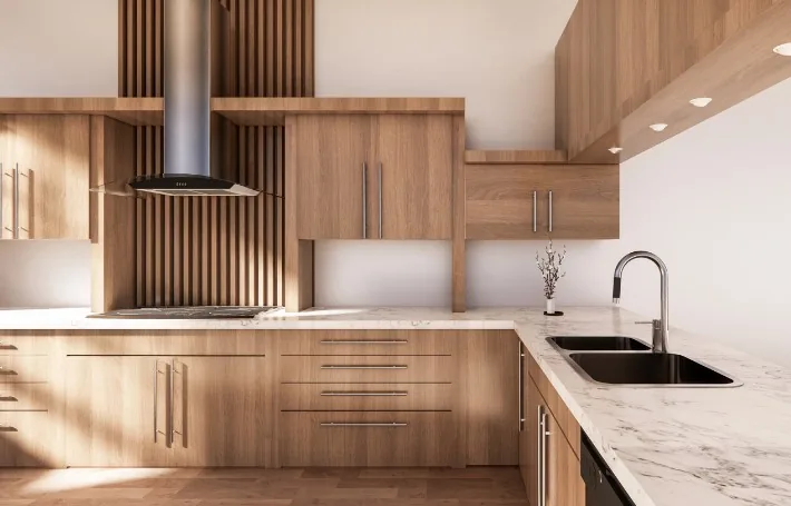 Cocina de roble claro con encimera de mármol blanco fabricada para un negocio de Aranda de Duero